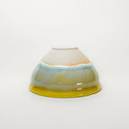 Ceramic tea cup with a gradient design on a white background