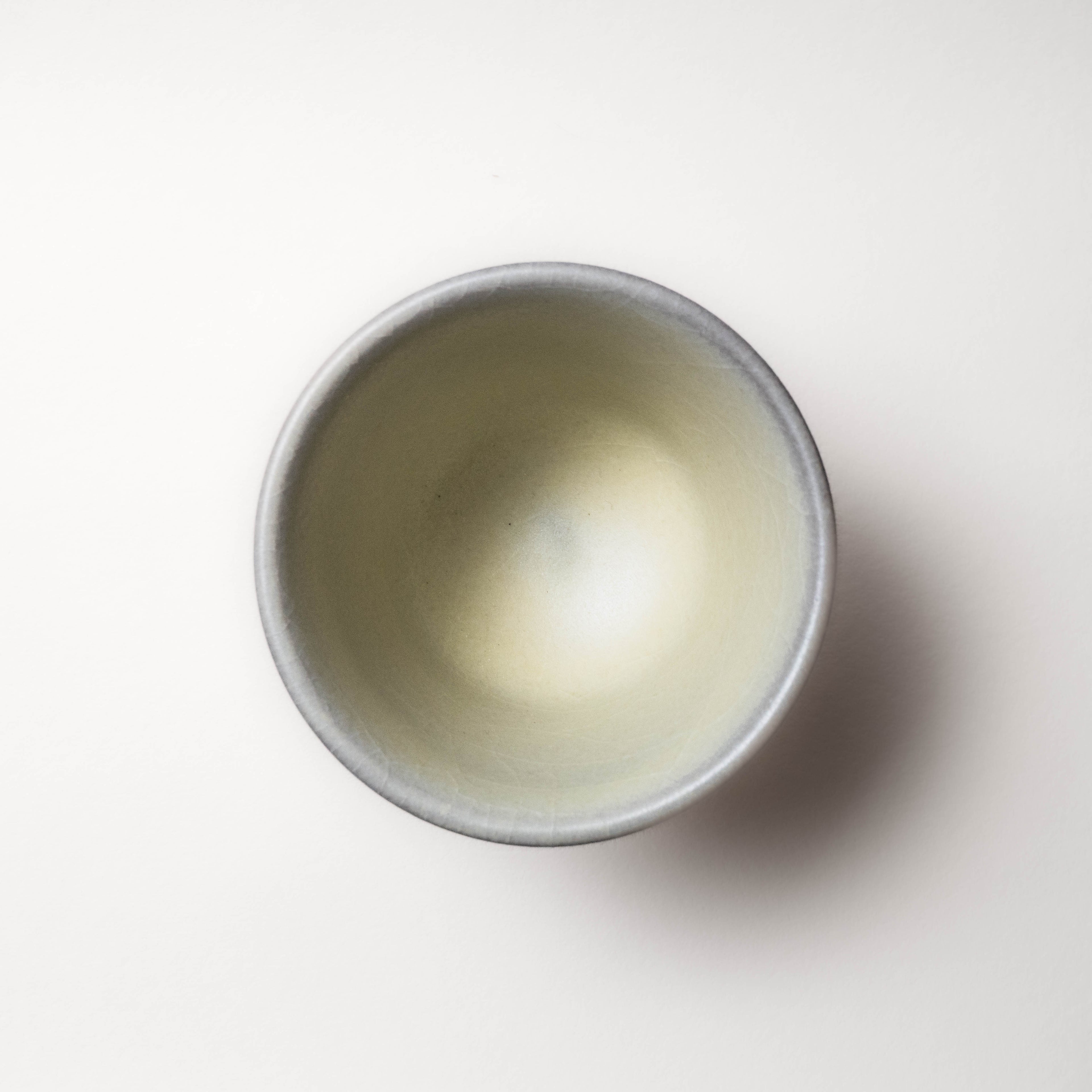 Ceramic tea cup on a white background